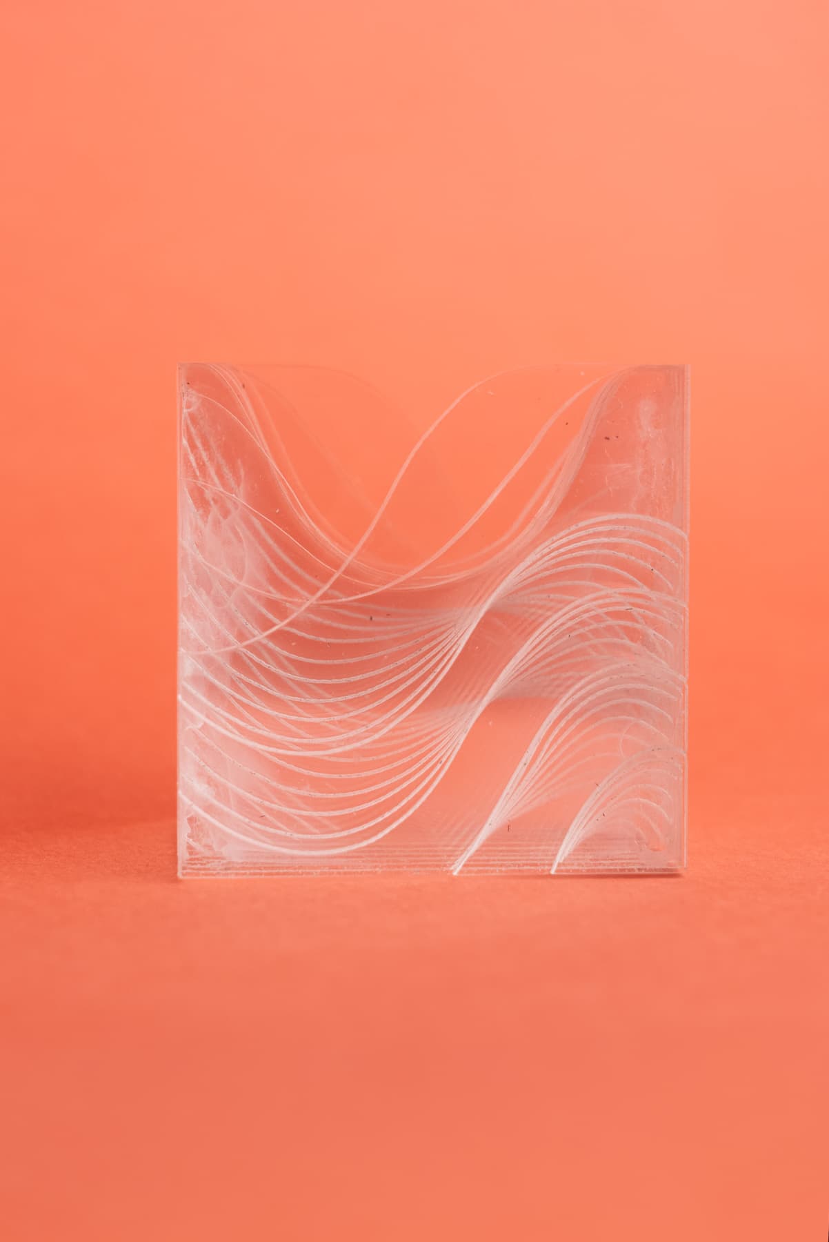 Front view of EggHolder 9 showing the engraved lines on each piece forming a wave that moves through the whole model.