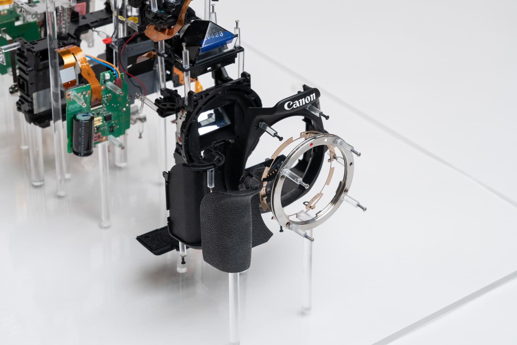 Close-up of the font of the model. Focus is placed on the lens mount ring and front shell of the camera.