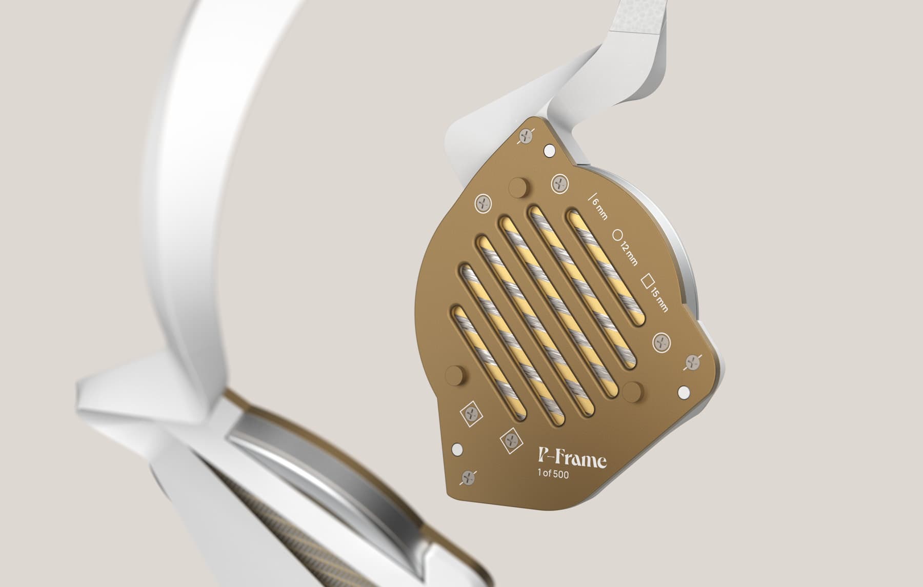 Close-up view of the left grill without the earpad. Square, circle, and line markings denote the length of screw that goes into each hole. The text ‘P-Frame, 1 of 500’ is printed near the bottom of the grill.