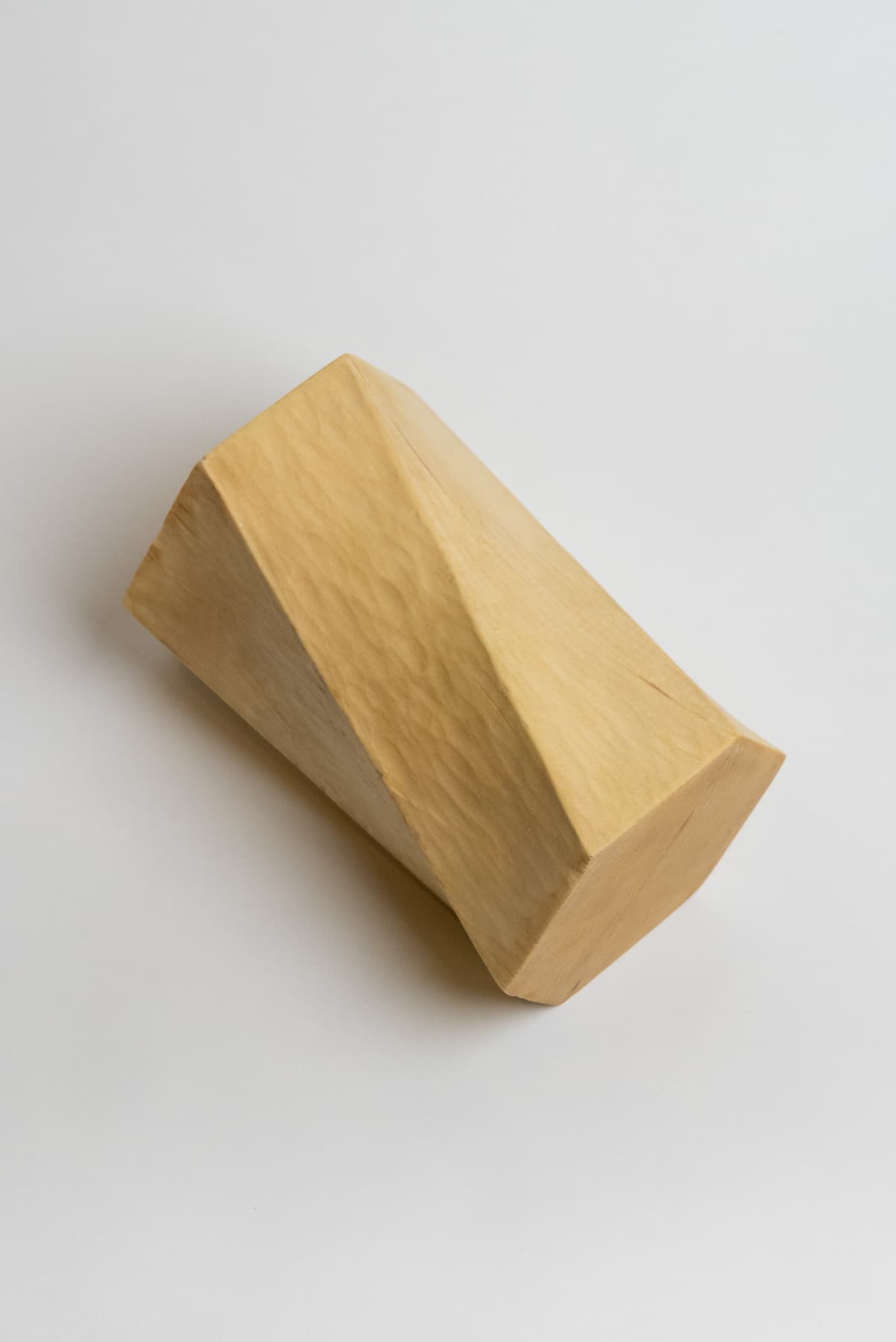 The pine piece laying flat on its side.
